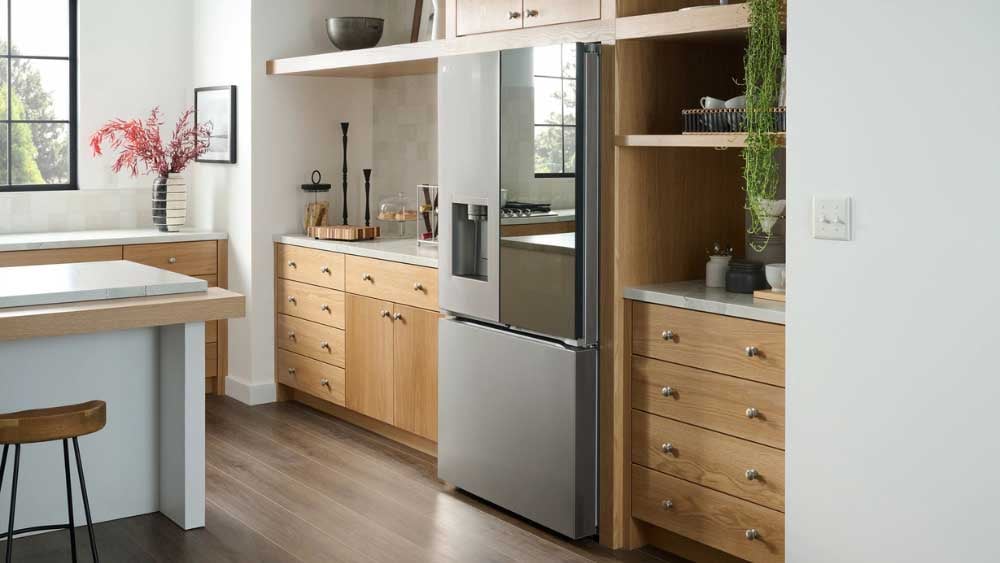 French door counter-depth refrigerator with external dispenser—one of the most commonly serviced appliance styles due to ice and water system issues
